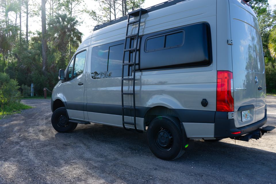 A Drifter with a side ladder, roof rack and black wheels