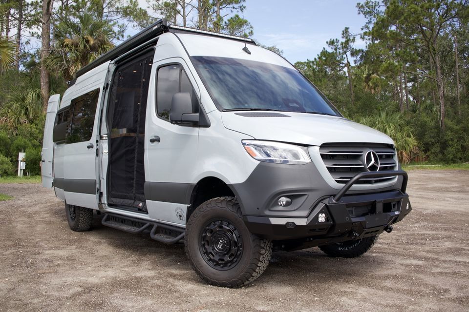 The Gamer Van exterior with a front bumper, side steps and roof rack