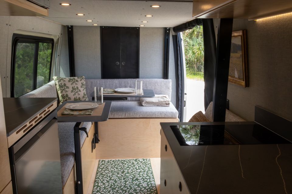The Oasis L-shaped lounge with a set table and upholstered bench seating